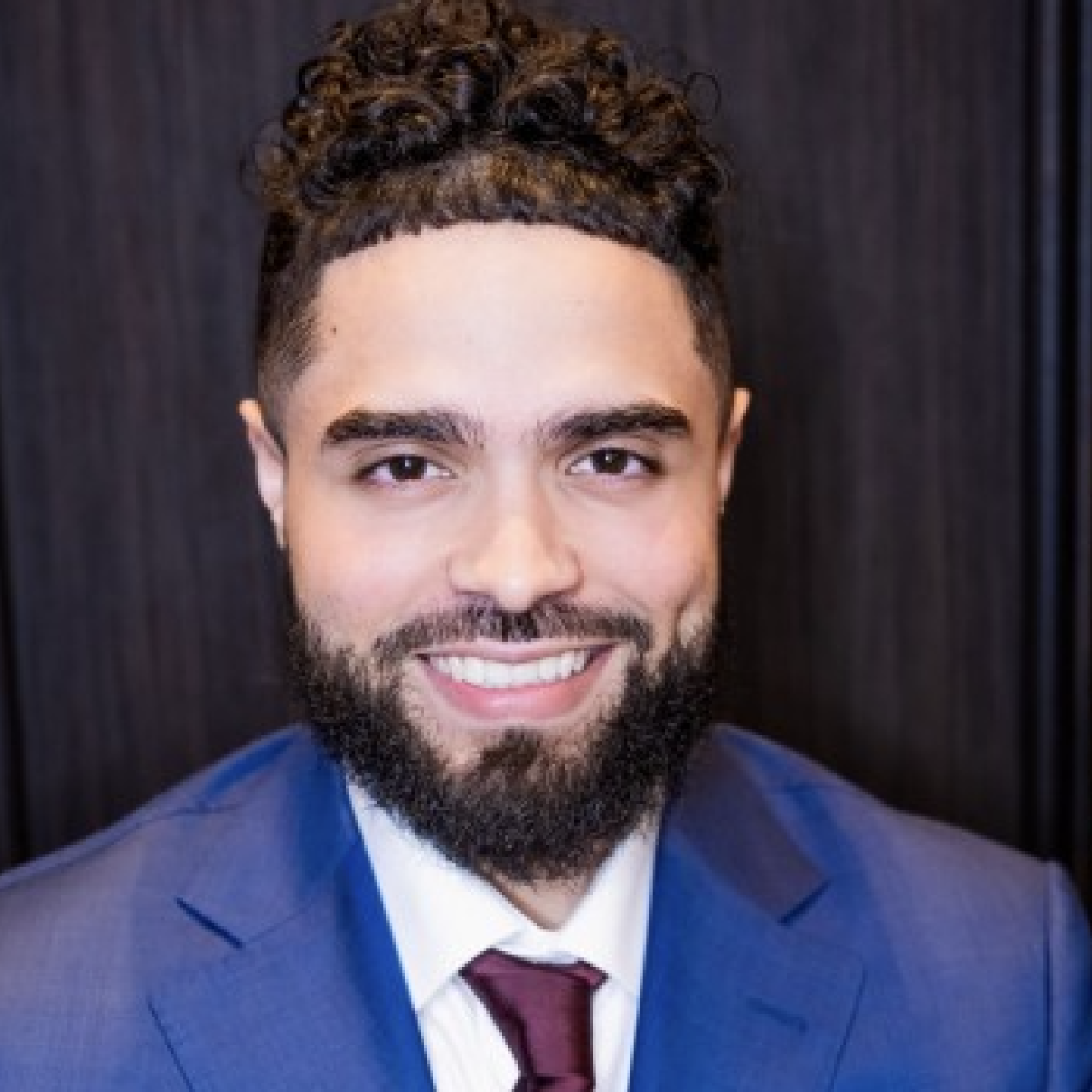 headshot of Noel Claudio