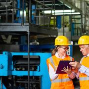 Two individuals discussing industrial equipment