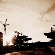 Crane and construction equipment at sunset, taken when IST Building was being constructed.