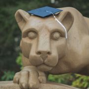 Penn State Nittany Lion statue wearing a graduation cap
