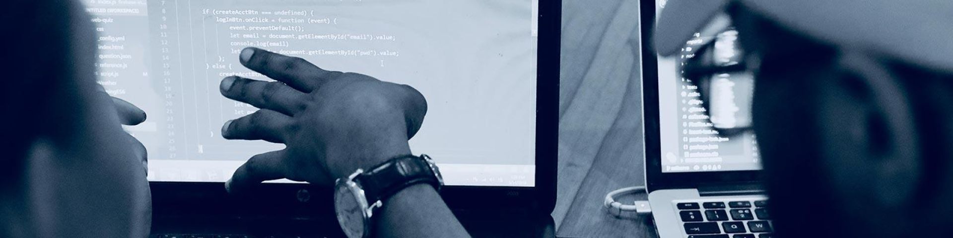 Students looking at code on a screen