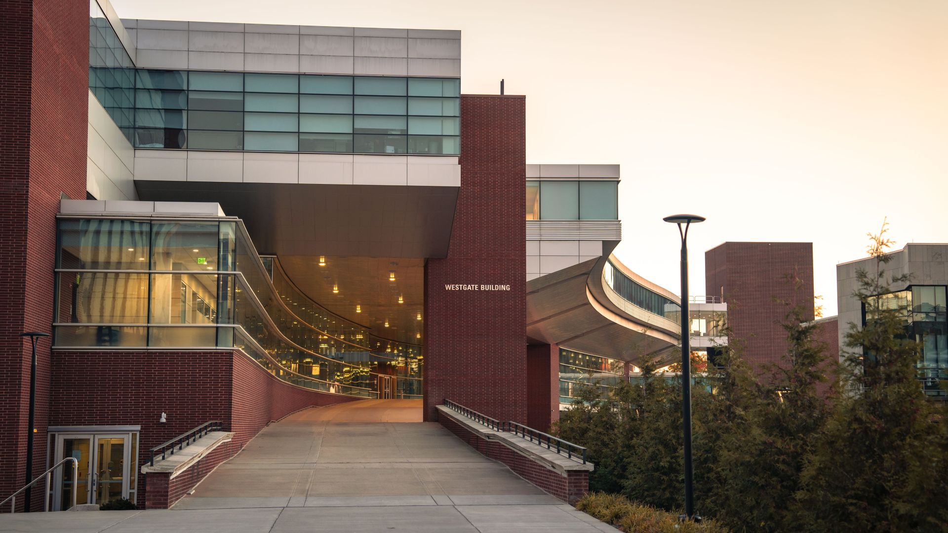 Westgate Building, the home to the College of IST. Two story brick and glass building.