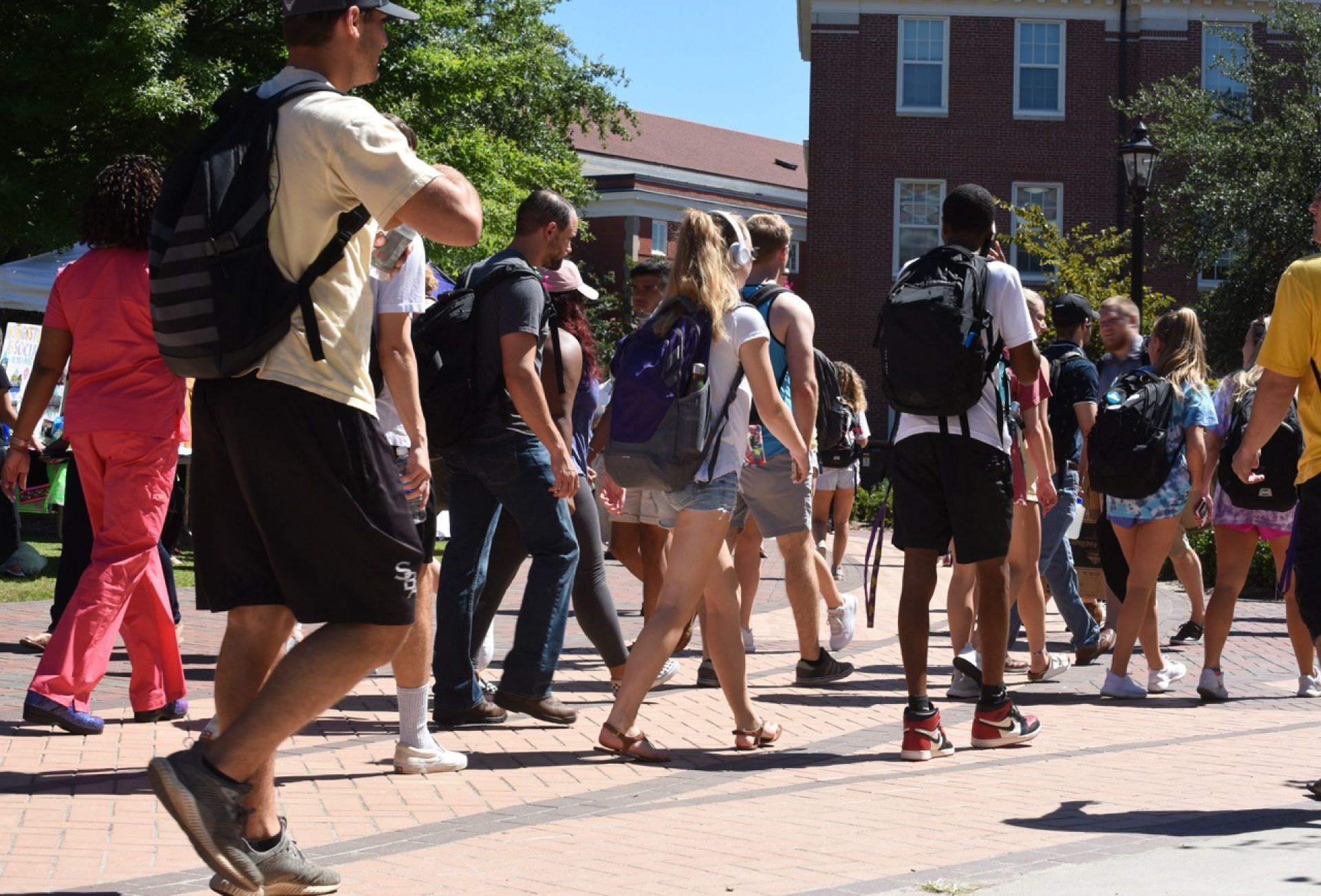 college students walking across campus