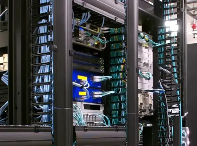 Server room with racks of equipment.