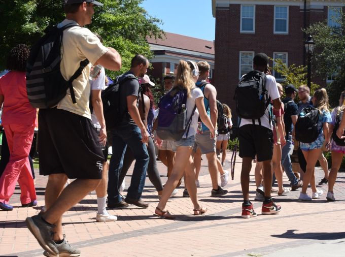 college students walking across campus