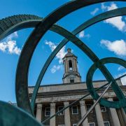 Old Main with sculpture in the foreground