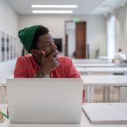 Thoughtful adult in a college class.