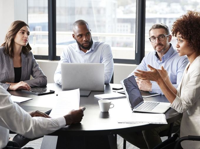 IT professionals having a meeting in a conference room.