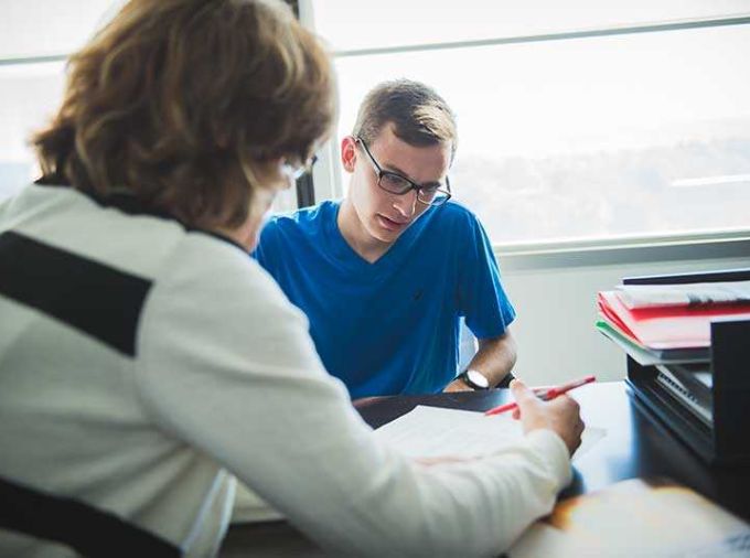 tutor reviewing student work