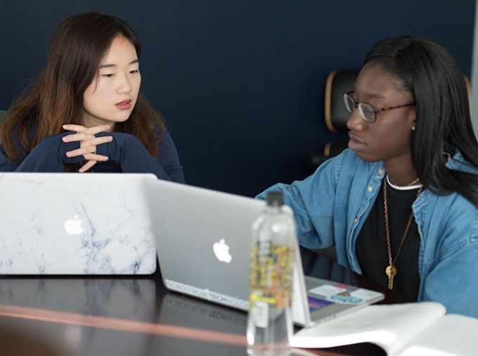 Two students using laptops