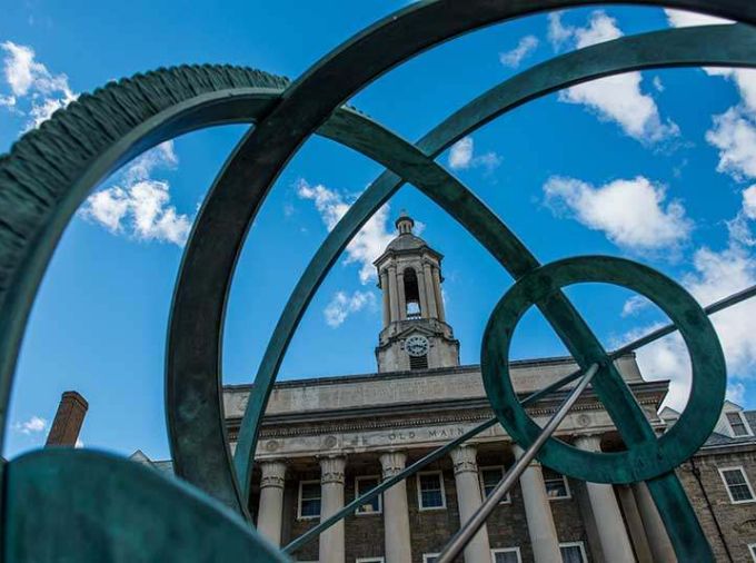 Old Main with sculpture in the foreground