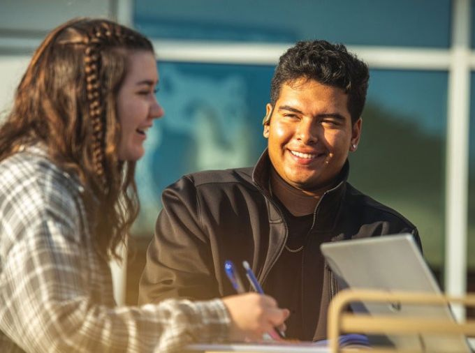 Students working and laughing