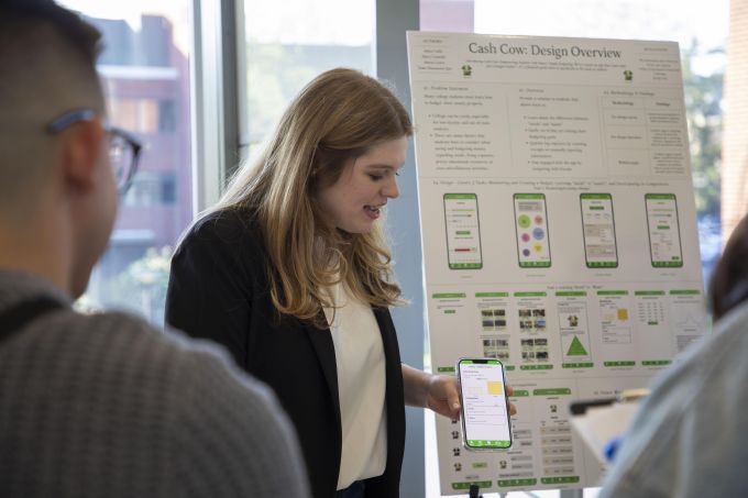 A student presents at the success showcase.