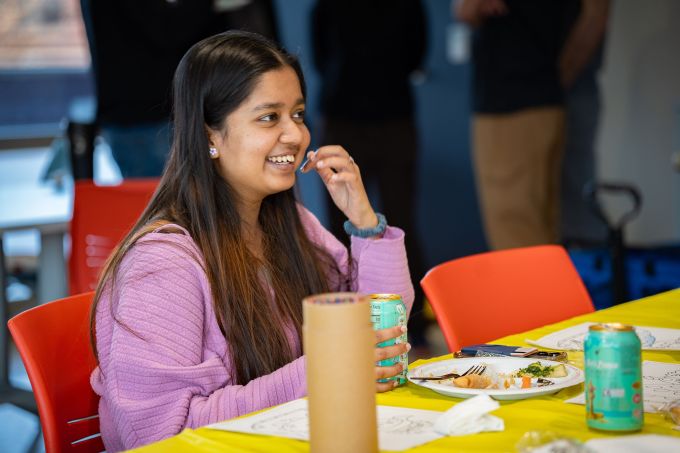 A student smiles.
