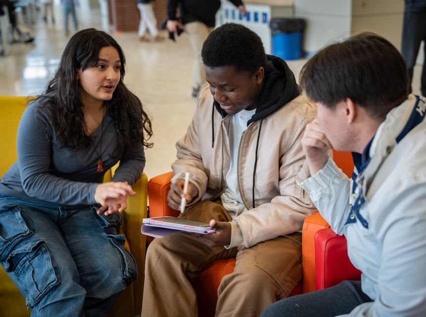 Three students having an informal meeting.