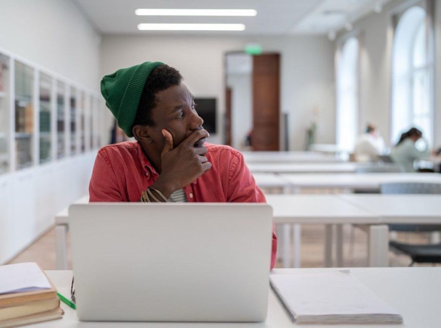 Thoughtful adult in a college class.