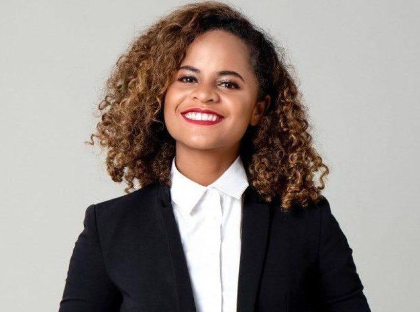 Happy smiling student in formal business attire.