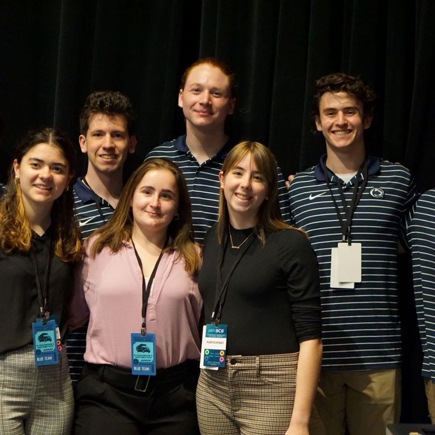 The Competitive Cyber Security Organization poses for a photo at an event.