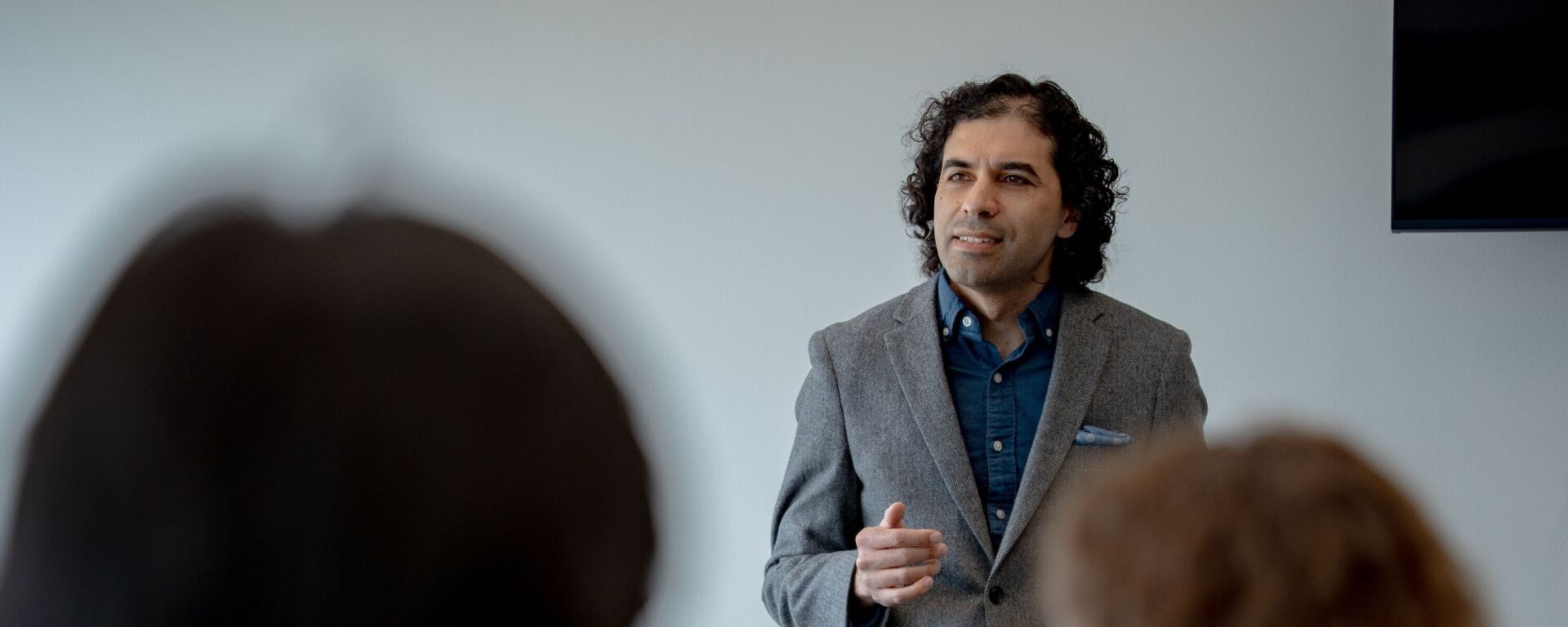 Shomir Wilson teaching in a classroom.