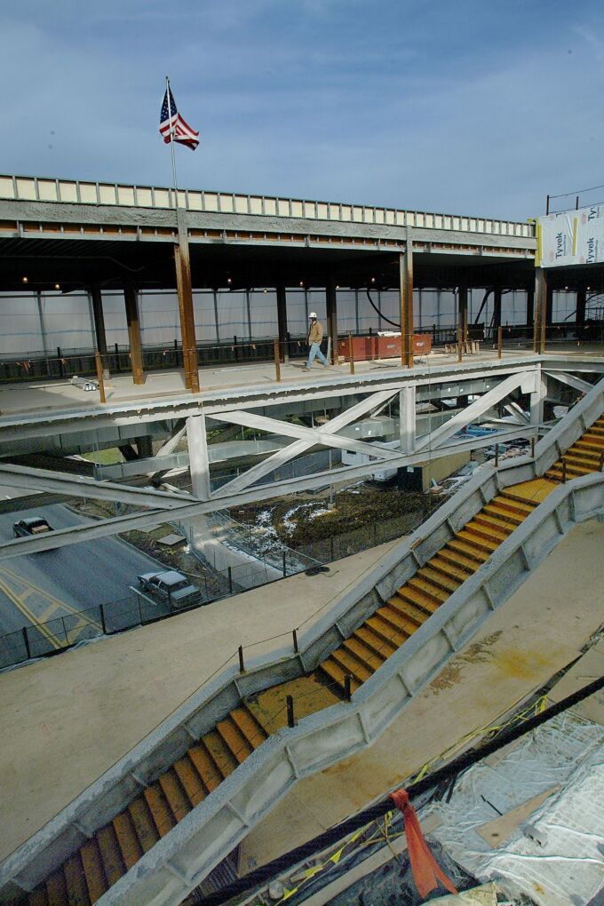 Construction of a building with a large staircase in the middle.