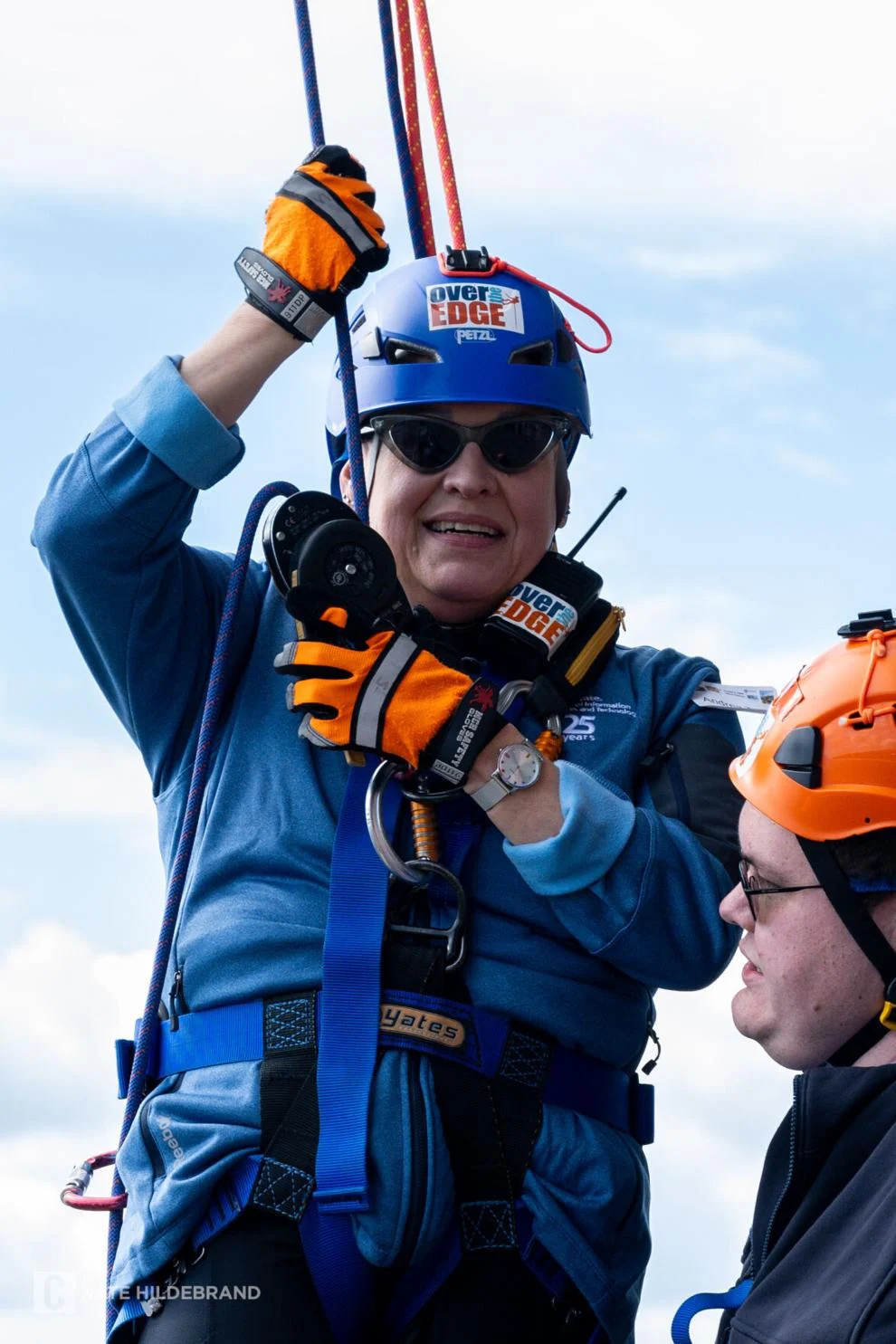 person in rappelling gear