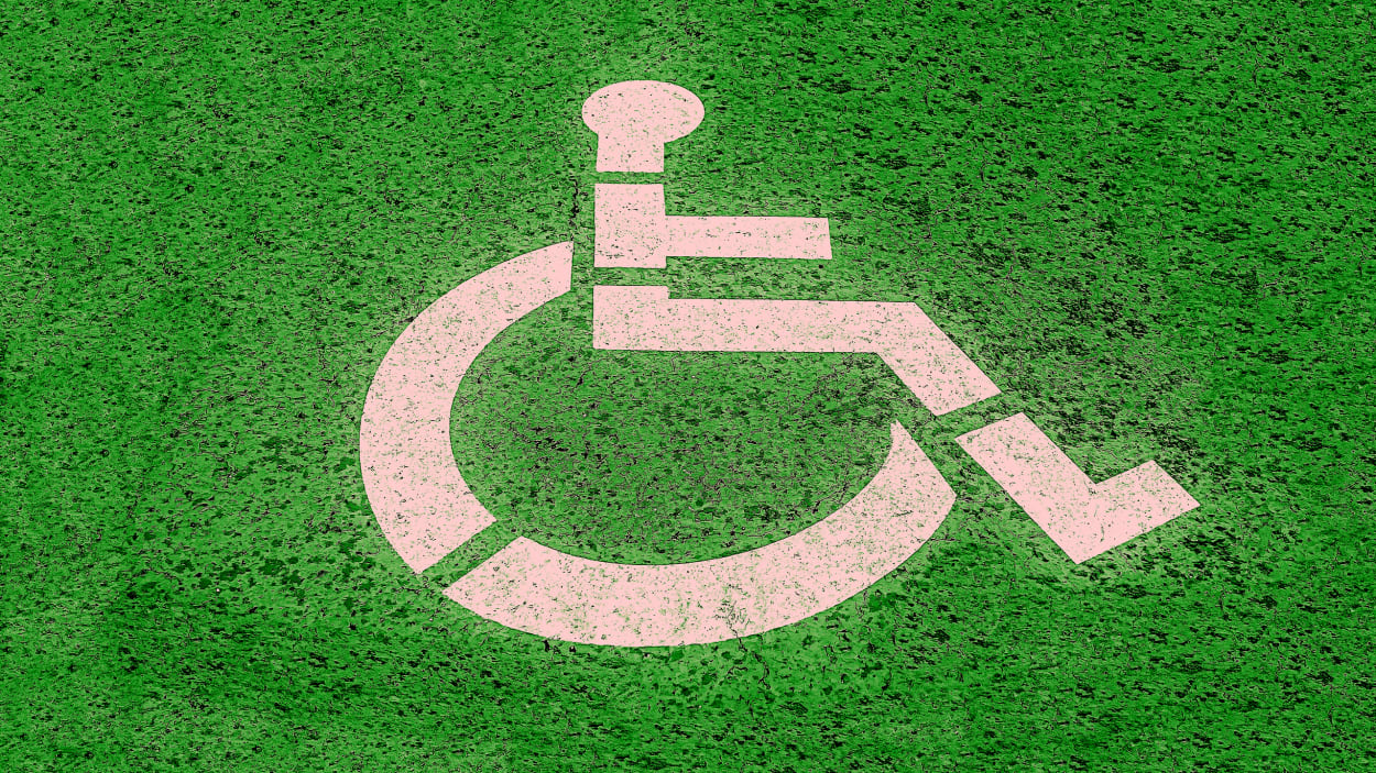 Stock photo of disability graphic on grass